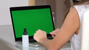 Free Stock Video Using The Hand Sanitizer Before Using The Laptop Live Wallpaper
