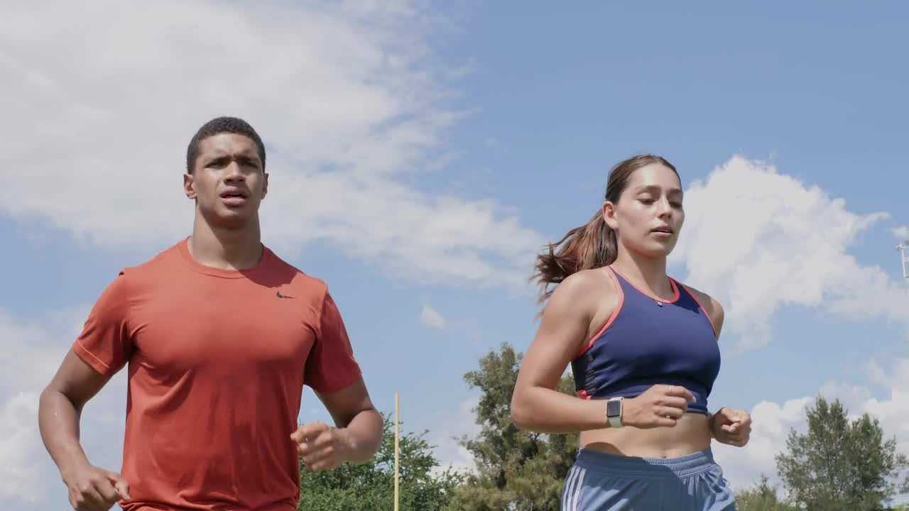 Download Free Stock Video Two People Running Outdoors On A Sunny Day Live Wallpaper