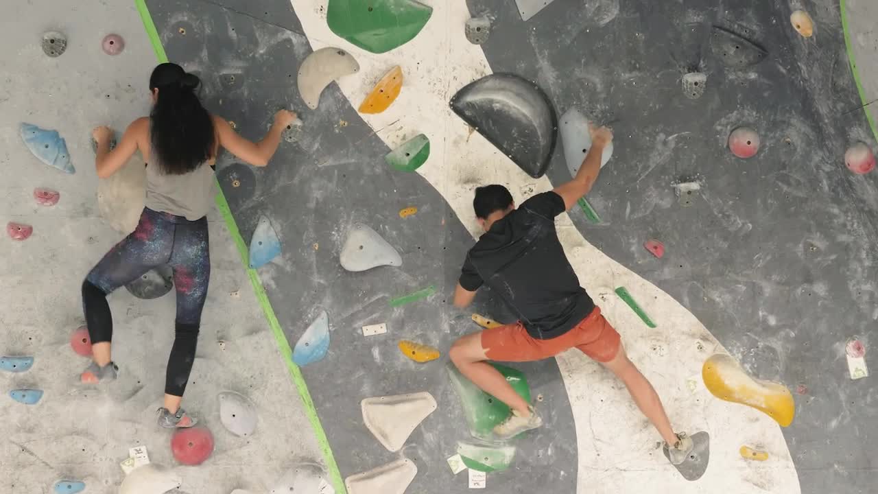Download Free Stock Video Two People Practicing Mountaineering On A Wall Live Wallpaper
