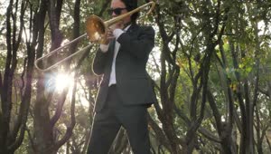 Free Stock Video Trombone Musician In The Middle Of Nature Live Wallpaper