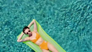 Free Stock Video Young Woman Sunbathing On A Inflatable Pool Bed Live Wallpaper