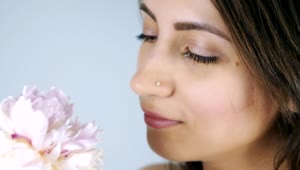 Free Stock Video Young Woman Smelling A White Flower Live Wallpaper