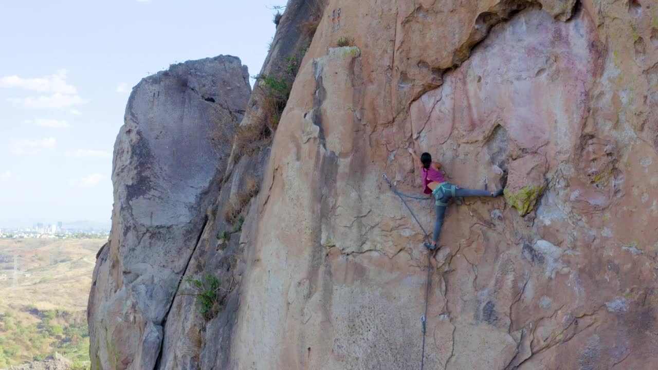 Download Free Stock Video Young Woman Practicing Extreme Mountaineering On A Mountain Live Wallpaper