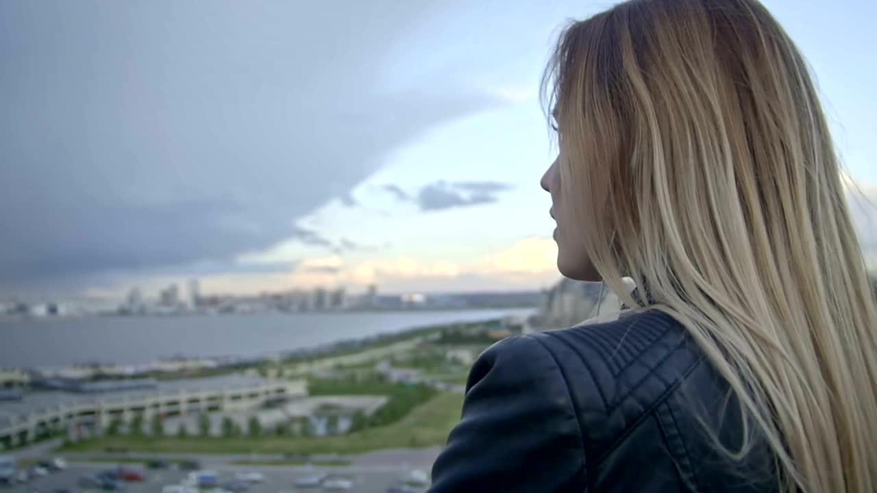 Download Free Stock Video Young Woman Observing The Horizon From Above Live Wallpaper