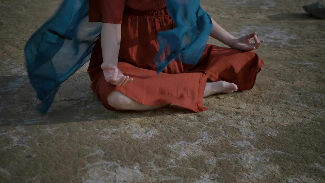 Download Free Stock Video Young Woman Meditating Sitting On The Ground Live Wallpaper
