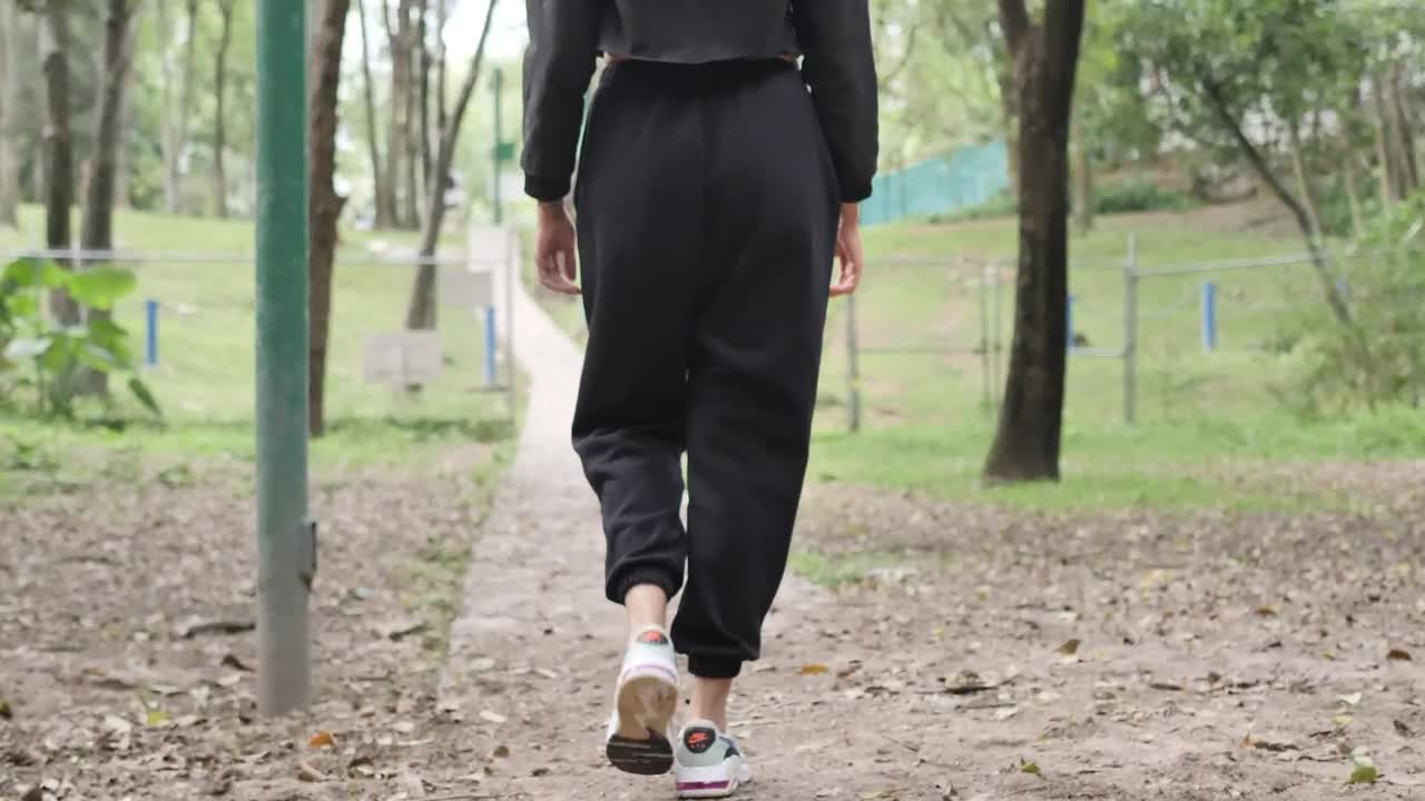 Download Free Stock Video Young Woman From Behind Walking In Nature Live Wallpaper