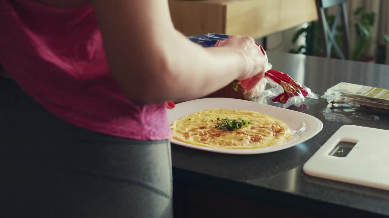 Download Free Stock Video Young Woman Finishing Preparing Her Breakfast Live Wallpaper