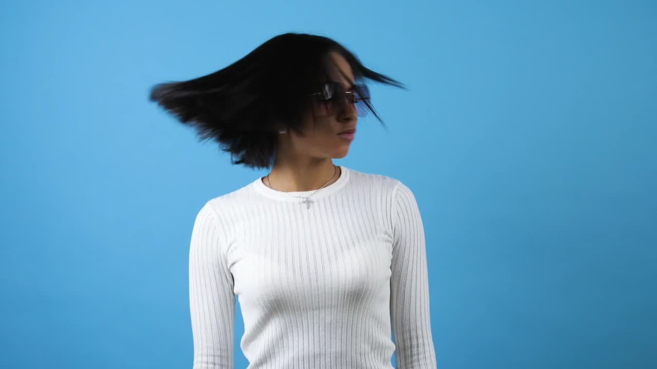 Download Free Stock Video Young Woman Dancing On A Blue Background Live Wallpaper