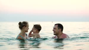 Free Stock Video Young Parents Playing In The Ocean Live Wallpaper