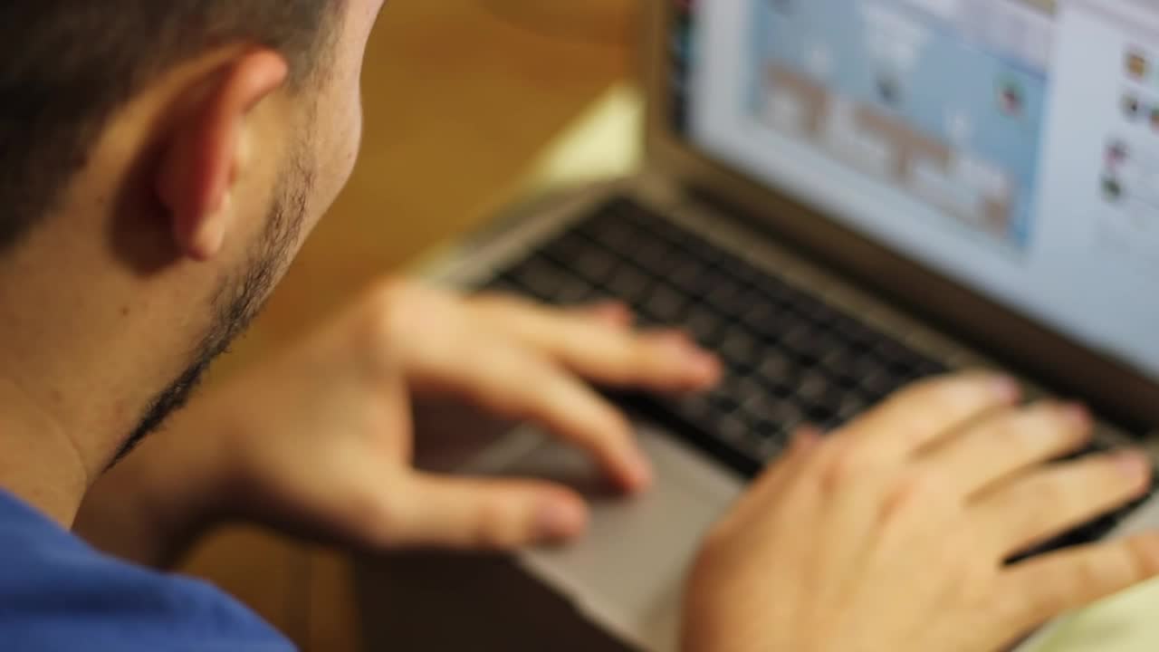 Download Free Stock Video Young Man Working On A Laptop Live Wallpaper