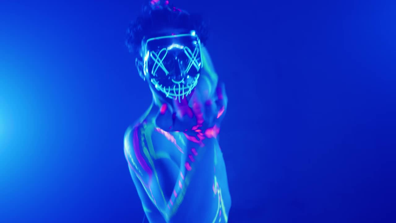 Download Free Stock Video Young Man With A Halloween Neon Mask Dancing Live Wallpaper