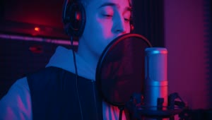 Free Stock Video Young Man Singing With A Microphone In A Studio Live Wallpaper