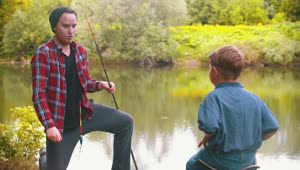 Free Stock Video Young Man Gives A Fishing Rod To A Boy In Live Wallpaper