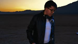 Free Stock Video Young Dj Playing On A Desert Plane At Sunset Live Wallpaper