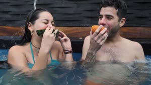 Free Stock Video Young Couple Eating Fruit In The Swimming Pool Live Wallpaper