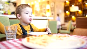 Free Stock Video Young Boy Eating Pizza At A Cafe Live Wallpaper