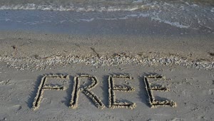 Free Stock Video Word Free Written In The Sand On A Sunny Beach Live Wallpaper