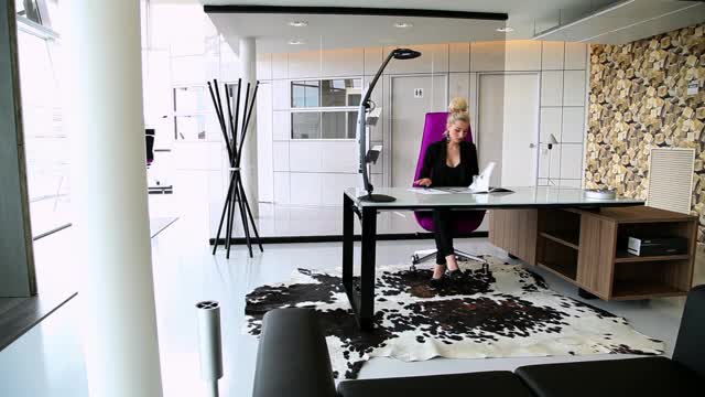 Download Free Stock Video Woman Working In A Large Office Smalllive Wallpaper