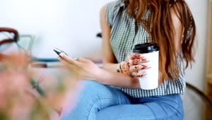 Free Stock Video Woman Texting And Holding A Coffee Live Wallpaper