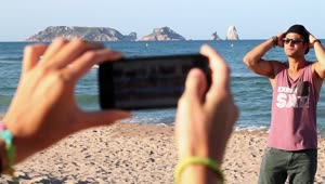 Free Stock Video Woman Taking Photos Of Her Boyfriend On The Beach Live Wallpaper