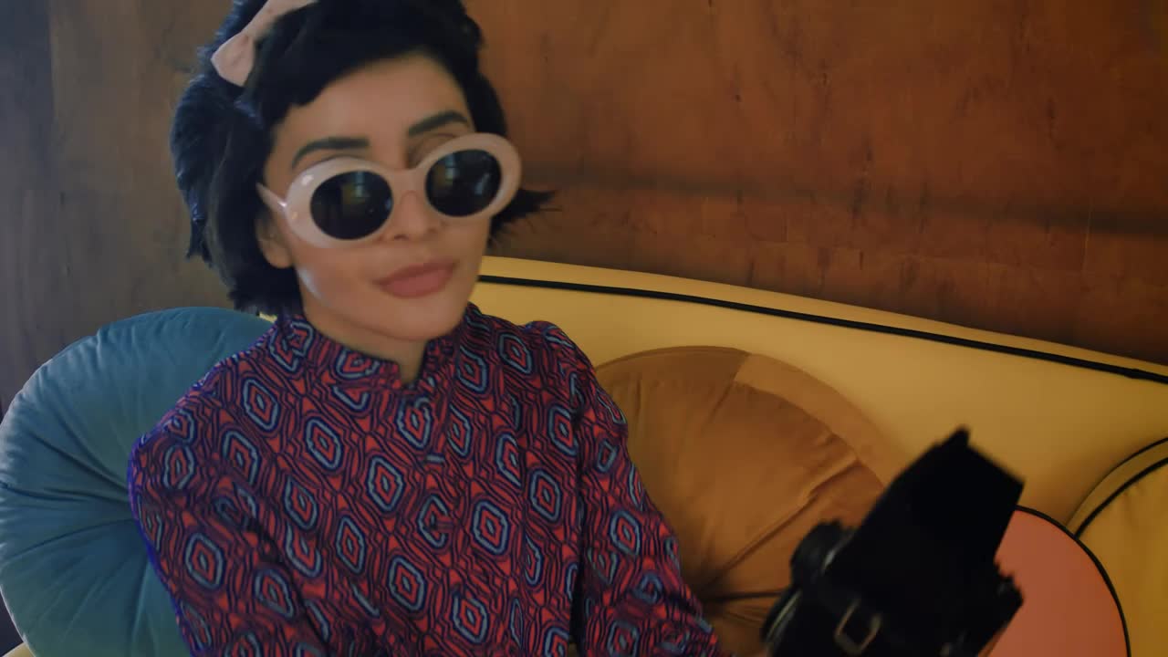 Download Free Stock Video Woman Taking A Selfie With An Old Camera Live Wallpaper