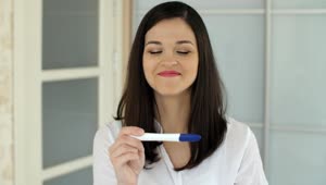 Free Stock Video Woman Rejoices After Seeing Her Pregnancy Test Live Wallpaper
