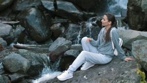 Free Stock Video Woman Relaxing By A Waterfall In A Forest Live Wallpaper