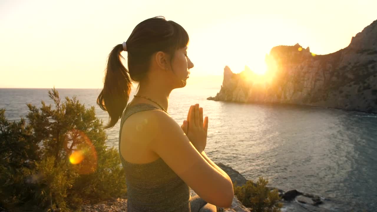 Download Free Stock Video Woman Meditating On The Beach At Sunset Live Wallpaper