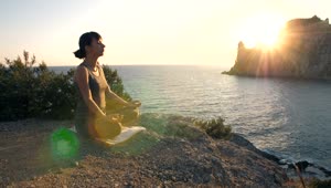 Free Stock Video Woman Meditating By The Sea At Sunset Live Wallpaper