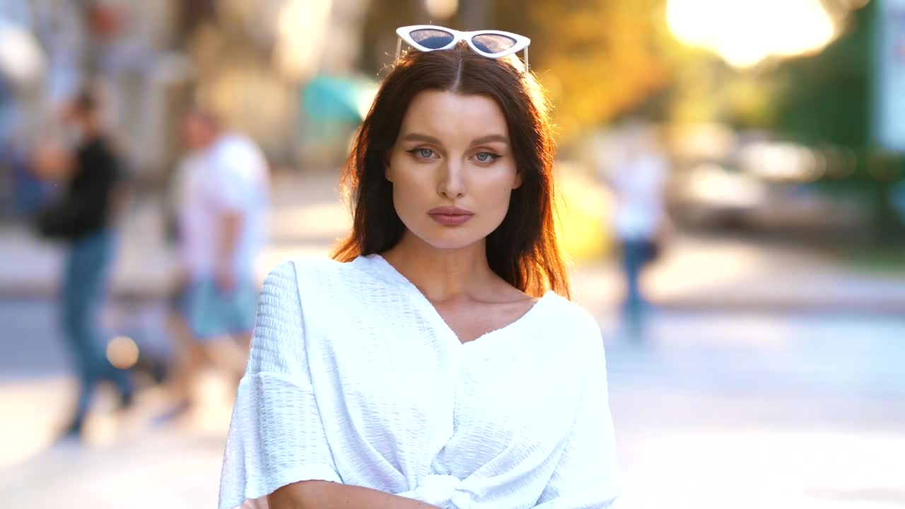 Download Free Stock Video Woman Looking To The Camera In The Street Live Wallpaper