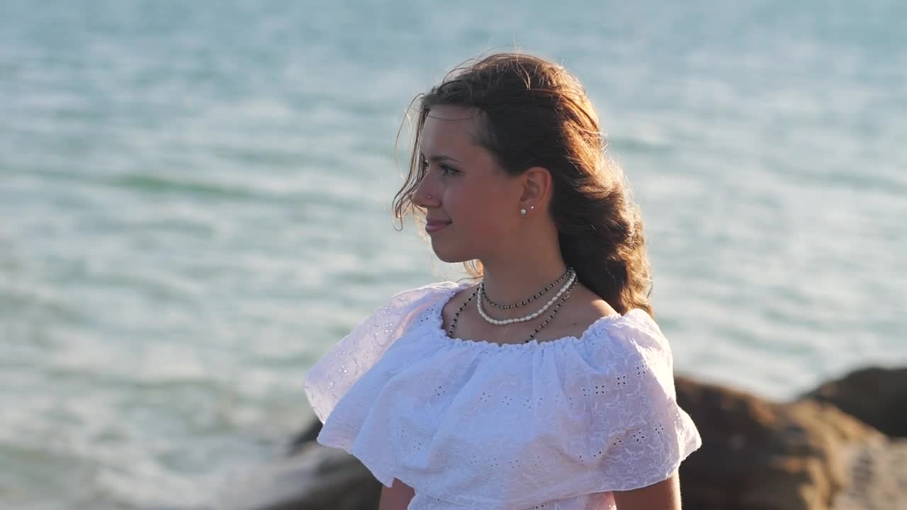 Download Free Stock Video Woman Looking Out To Sea On The Beach Live Wallpaper