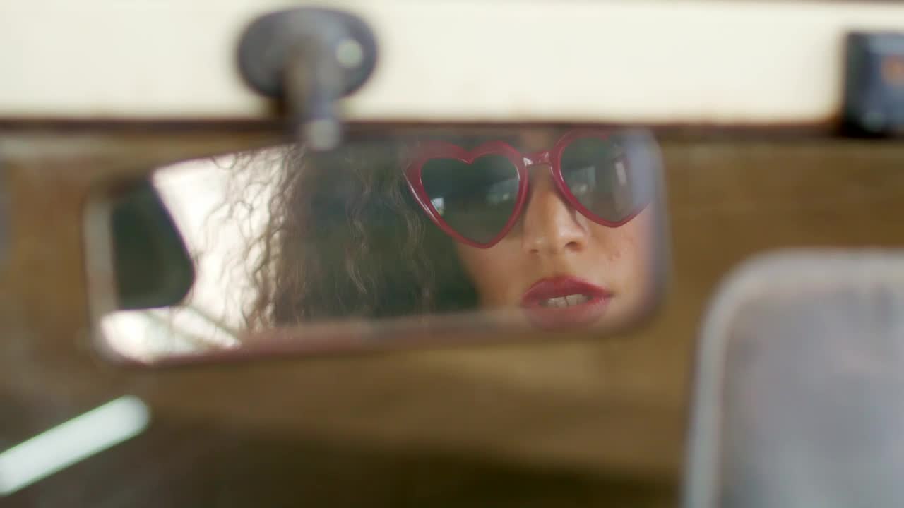 Download Free Stock Video Woman Looking In Rear View Mirror Live Wallpaper