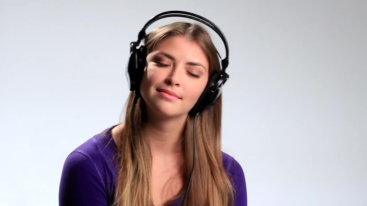 Download Free Stock Video Woman Listening To Music On Her Headphones Live Wallpaper
