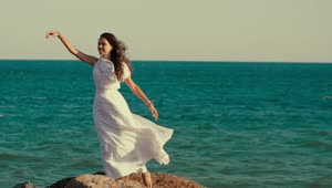 Free Stock Video Woman In White Dress Posing By The Sea Live Wallpaper