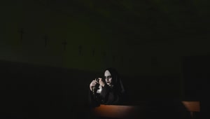 Free Stock Video Woman In Nun Costume On Halloween Praying In Church Live Wallpaper