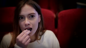 Free Stock Video Woman Eating Popcorn At The Cinema Live Wallpaper