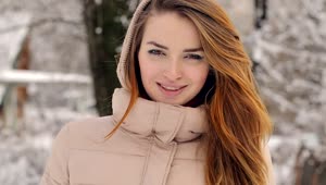 Free Stock Video Woman During Winter Watching And Smiling At Camera Live Wallpaper