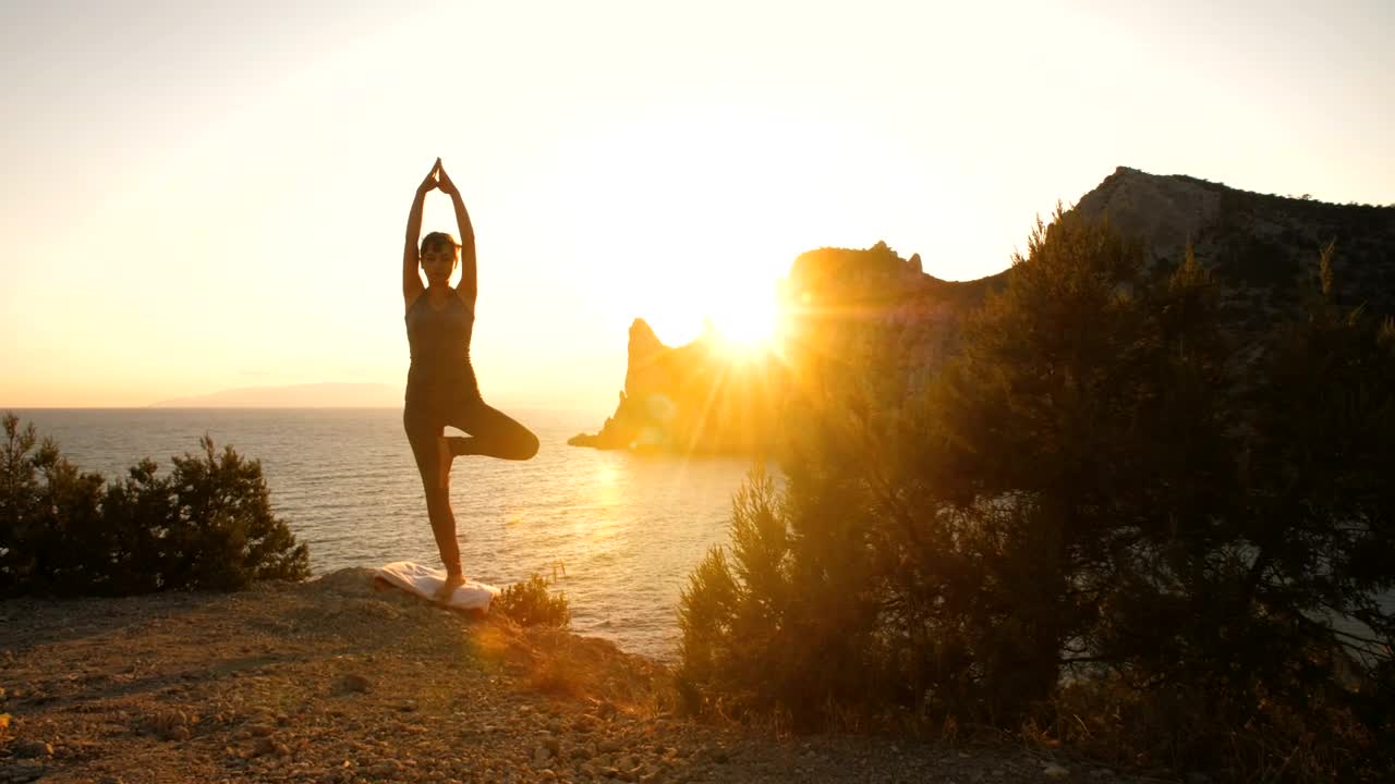 Download Free Stock Video Woman Doing Yoga By The Sea At Sunset Live Wallpaper