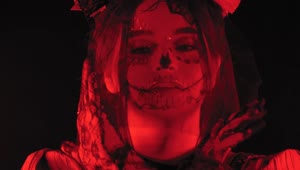 Free Stock Video Woman Disguised As A Catrina Under A Dim Red Light Live Wallpaper