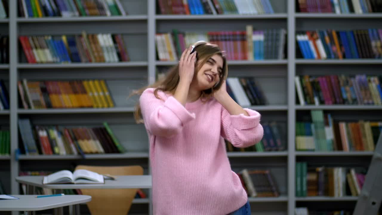 Download Free Stock Video Woman Dancing To Music From Her Headphones Live Wallpaper