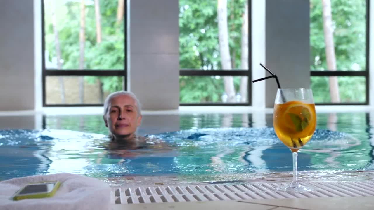 Download   Stock Footage Woman Checking Her Phone In The Pool Live Wallpaper