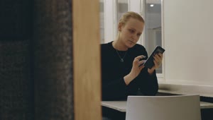   Stock Footage Woman Checking Her Phone In A Cafe Live Wallpaper