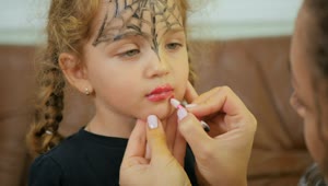   Stock Footage Woman Applies Lipstick To Little Girl For Halloween Live Wallpaper