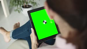   Stock Footage Woman Admires Website On Chromakey Tablet Live Wallpaper