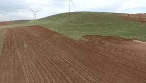   Stock Footage Wind Turbines In A Vast Green Plain Live Wallpaper