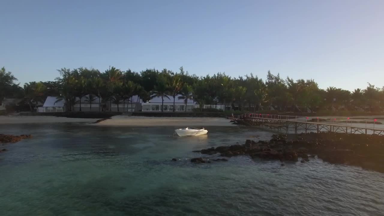 Download   Stock Footage White Boat Anchored By A Small Beach Live Wallpaper
