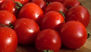   Stock Footage Wet Red Tomatoes On A Board Live Wallpaper