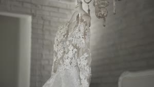   Stock Footage Wedding Dress Hanging On A Chandelier Live Wallpaper