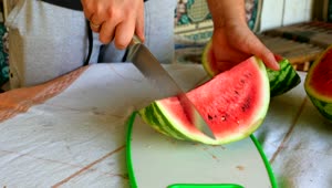   Stock Footage Watermelon Being Cut By Knife Live Wallpaper