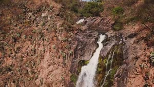   Stock Footage Waterfall Over Red Rocks Creating A Rainbow Live Wallpaper